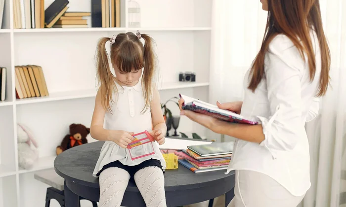 Child being assessed by specialist